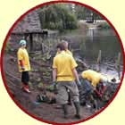 Volunteers planting pond